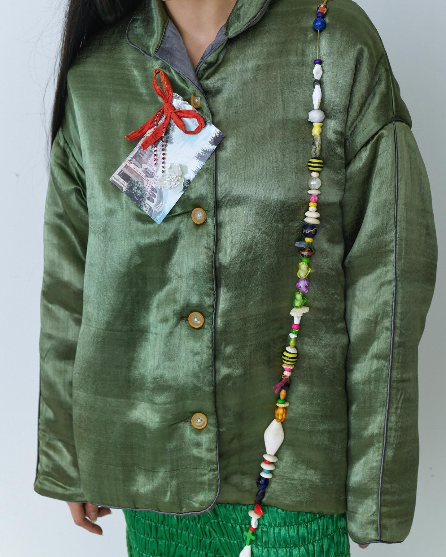lightweight puffy silk mashroo coat in olive green with grey mashroo lining / rubber buttons / our silk mashroo is woven on a century old pit loom in Patan, one of the few left in existence in the area
