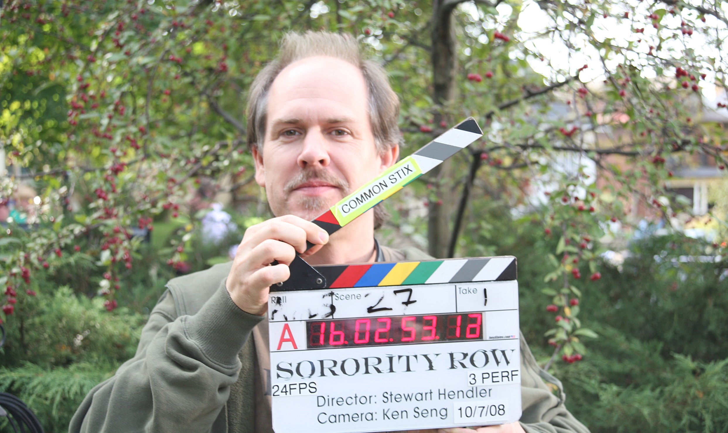 Slowing down production on Sorority Row by dorkily posing with the sticks. 