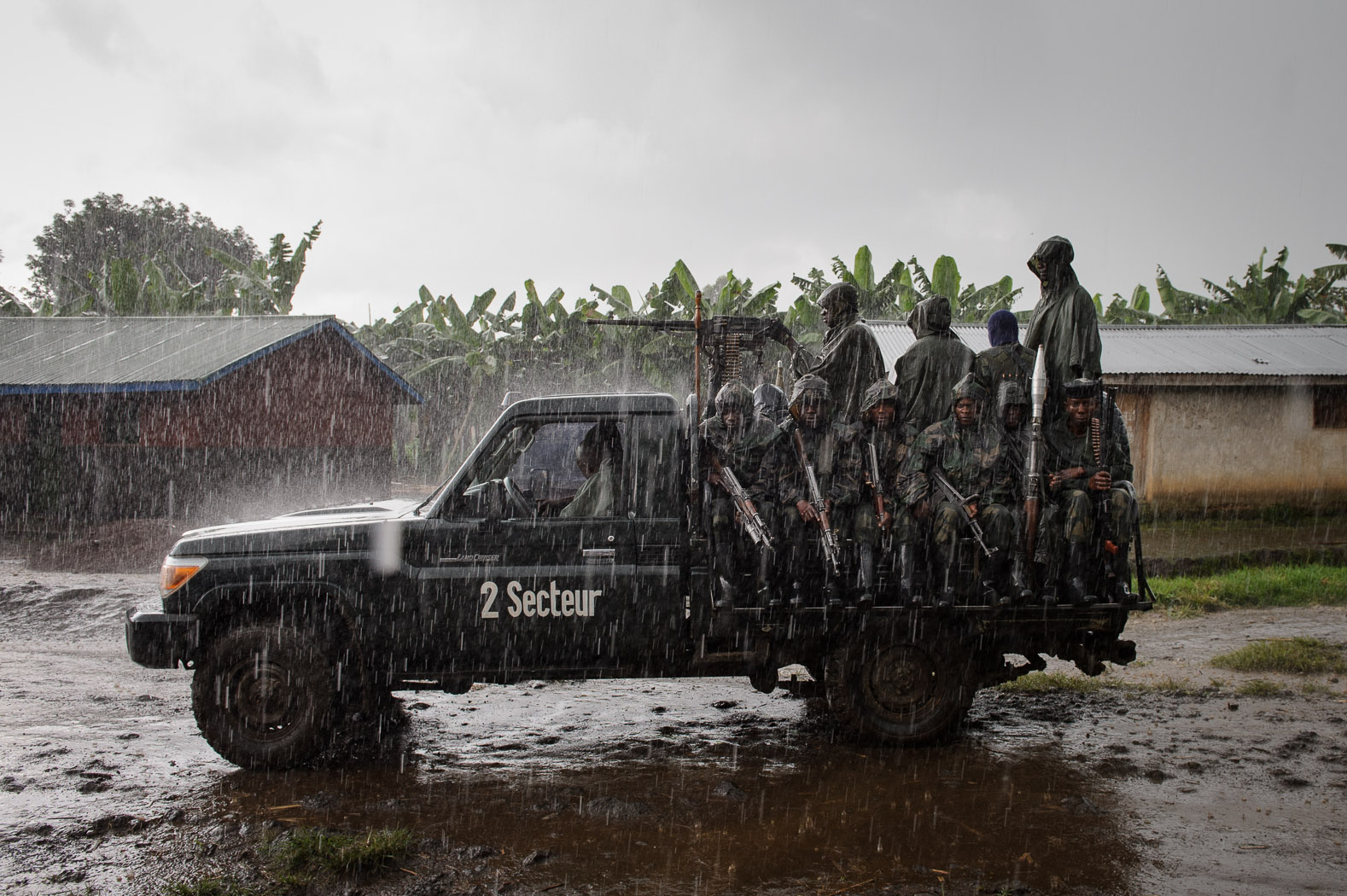 FARDC soldiers return from a firing position in eastern Congo, having attacked M23 encampments.