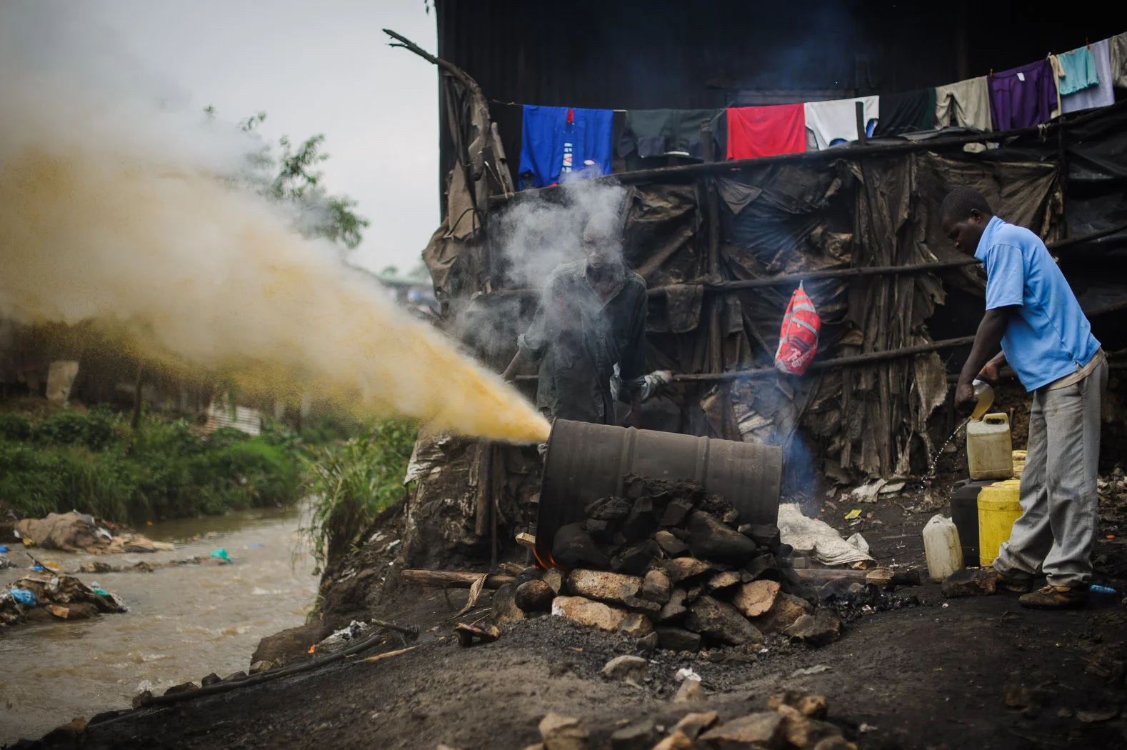 Brewing changaa, an illegal, potent alcohol, in Nairobi's Mathare slum, Kenya