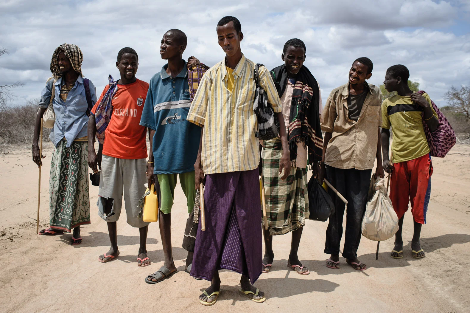 Somali refugees pose for a photograph just after having crossed the Somali-Kenyan border on their way to Kenya's Dadaab refugee camp during the drought of 2011