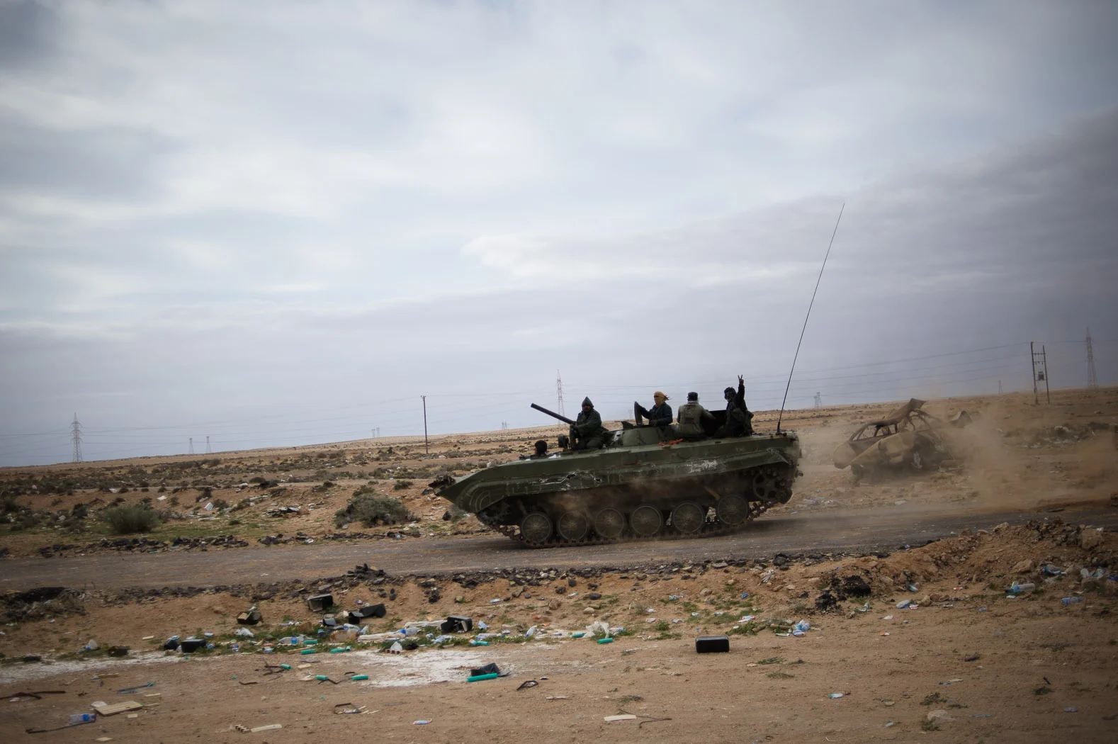 To the south, the front-line between rebels and loyalist troops shifted back-and-forth through the desert, with much of the early fighting between Ajdabiya and Ras Lanuf. Much of the rebel weaponry came from stockpiles left by retreating loyalist troops.