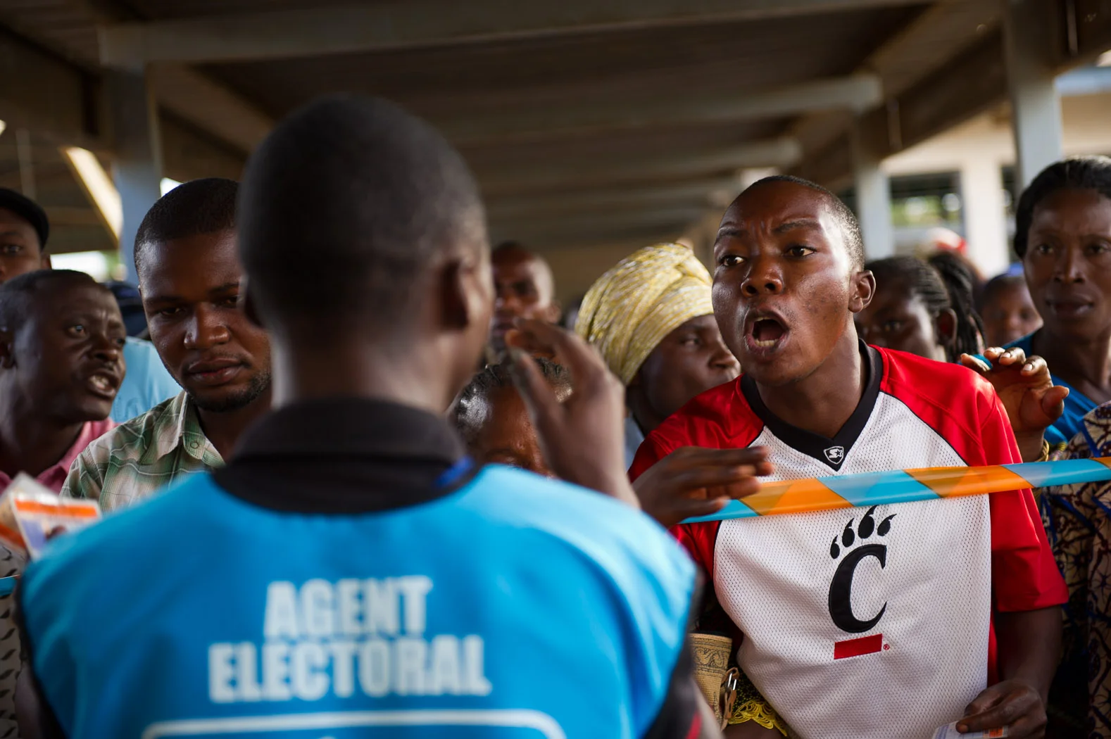 Tensions ran high as people queued to vote following the temporary closure of a polling affected by the shooting.