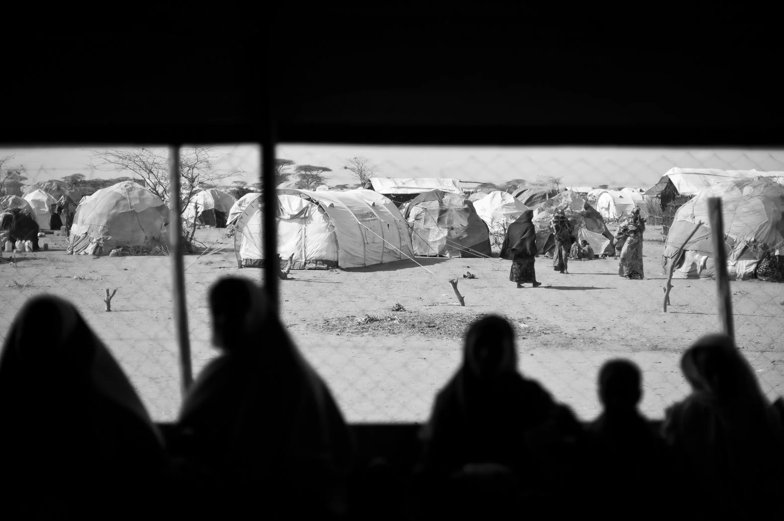 Mothers wait at a Médicins Sans Frontières (Doctors Without Borders) health outpost on the outskirts of Dagahaley Refugee Camp.