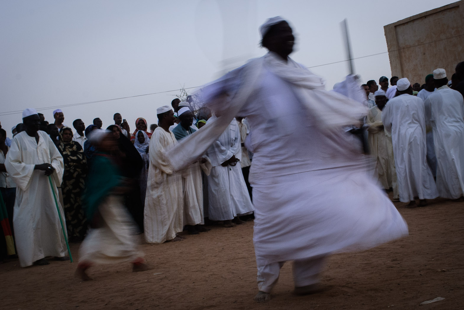 Sudanese sufis dance during a Friday congregation at the Hamid el-Nil mosque.