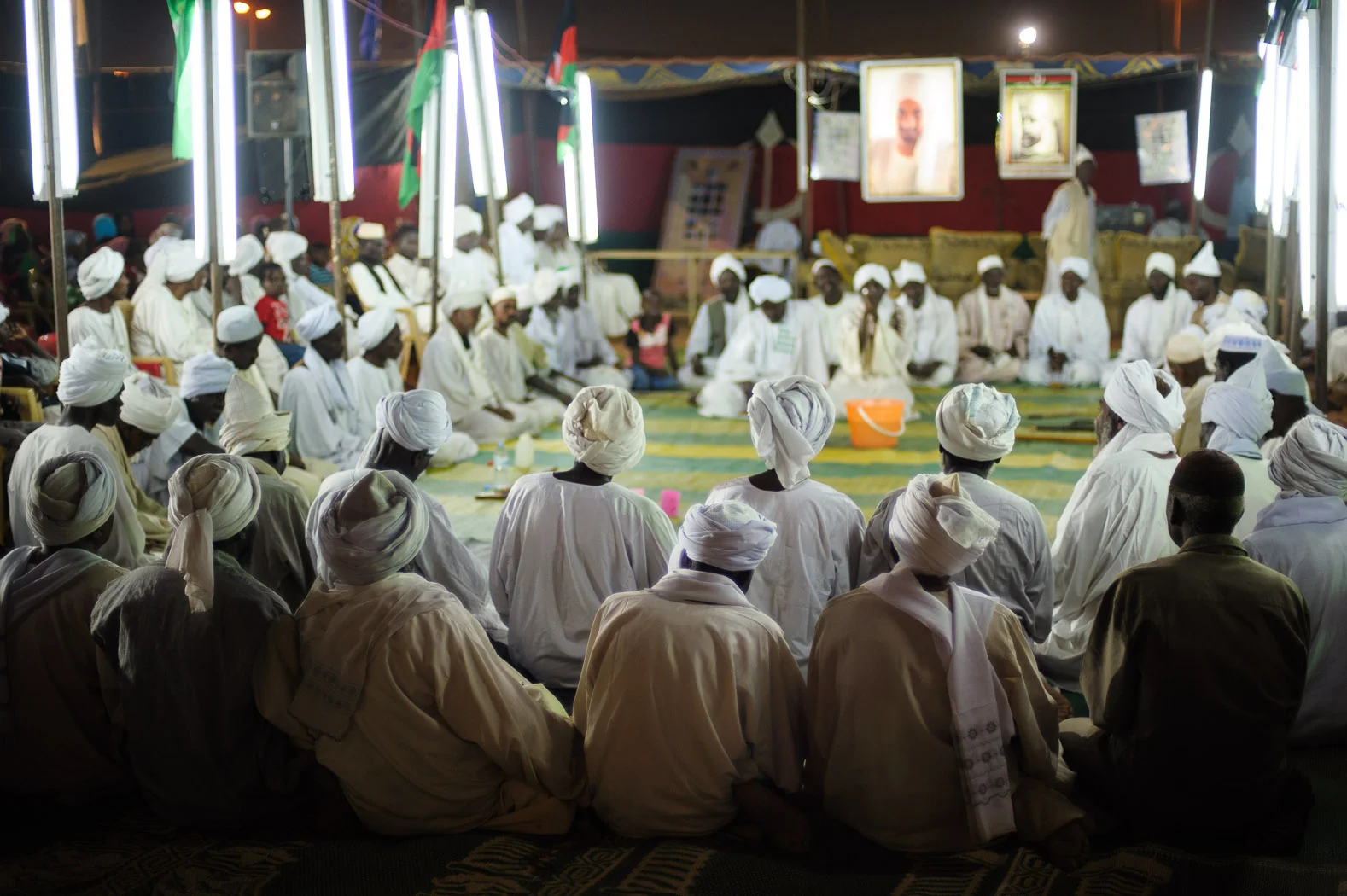 A group of sufis sit listening to stories of the life of the Prophet Mohamed.