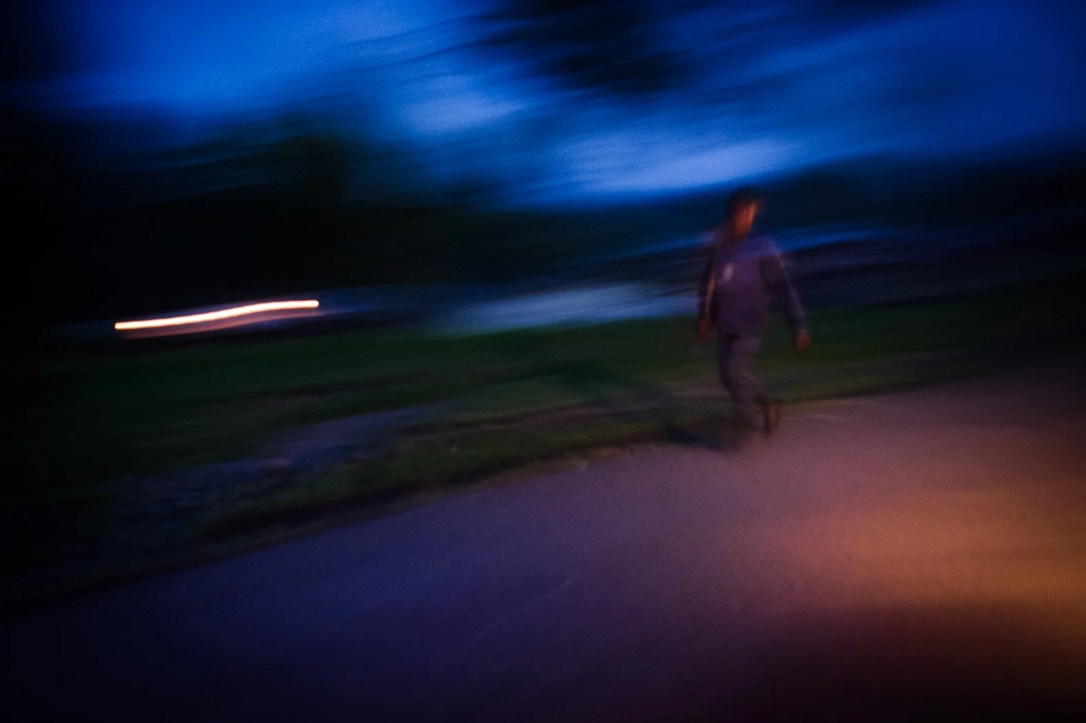A policeman walks along the road on the outskirts of Goma