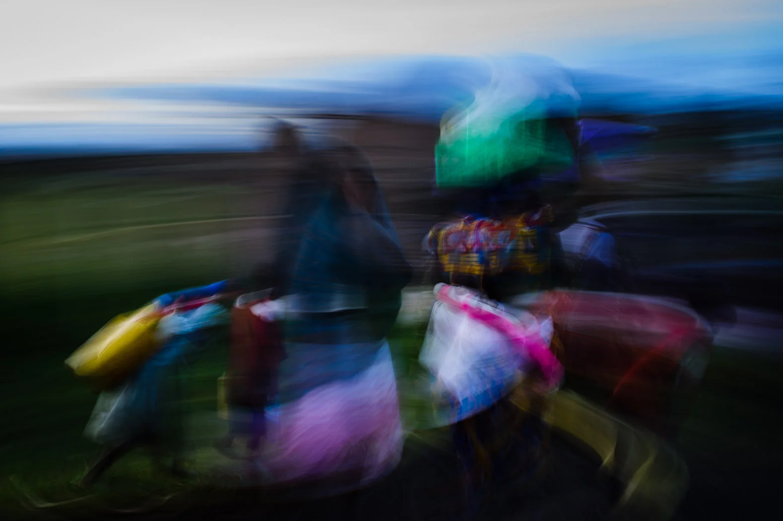 Congolese refugees carry their belongings towards the refugee camp in Kisoro, Uganda