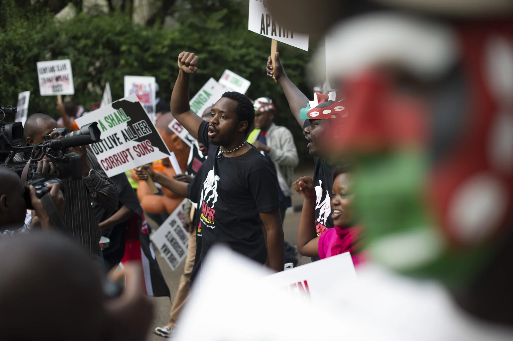 Boniface Mwangi leads a group of protestors towards central Nairobi 