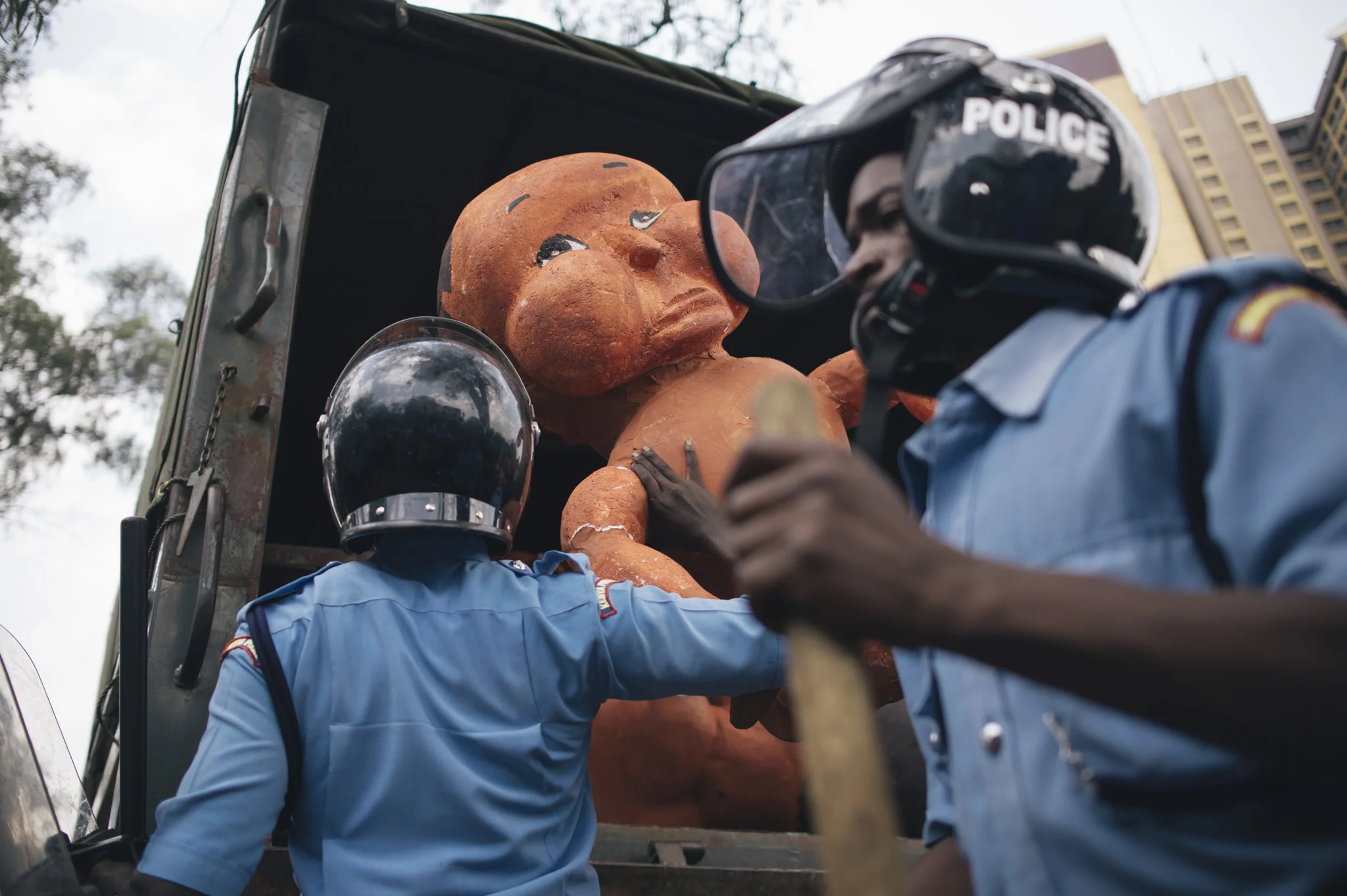 The babies are loaded into a police van