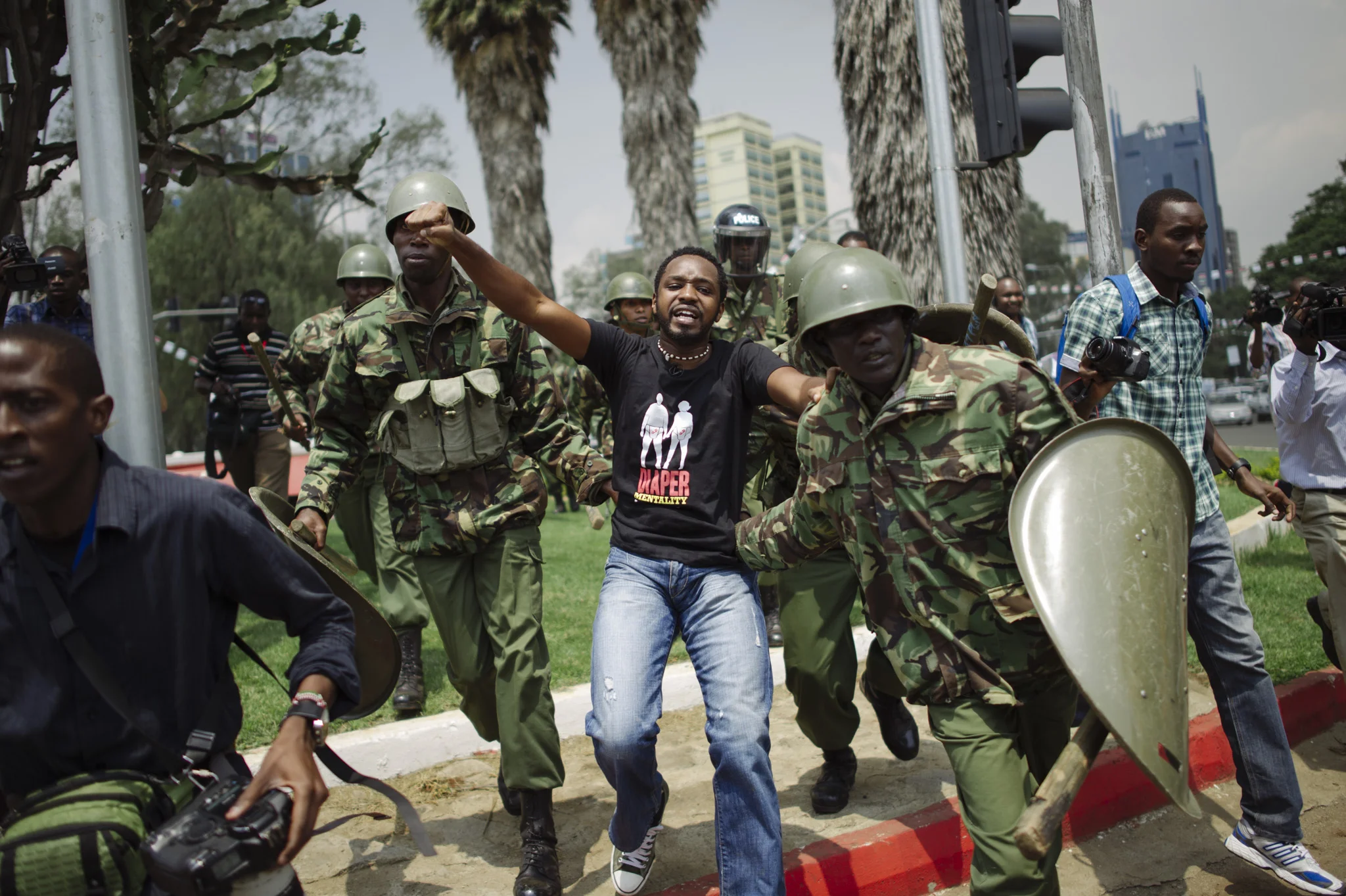 After several hours of cat-and-mouse chases in the area, activist Boniface Mwangi is arrested by Kenyan paramilitaries. (Moments later, he would escape when the police van he was loaded in got stuck in traffic.)