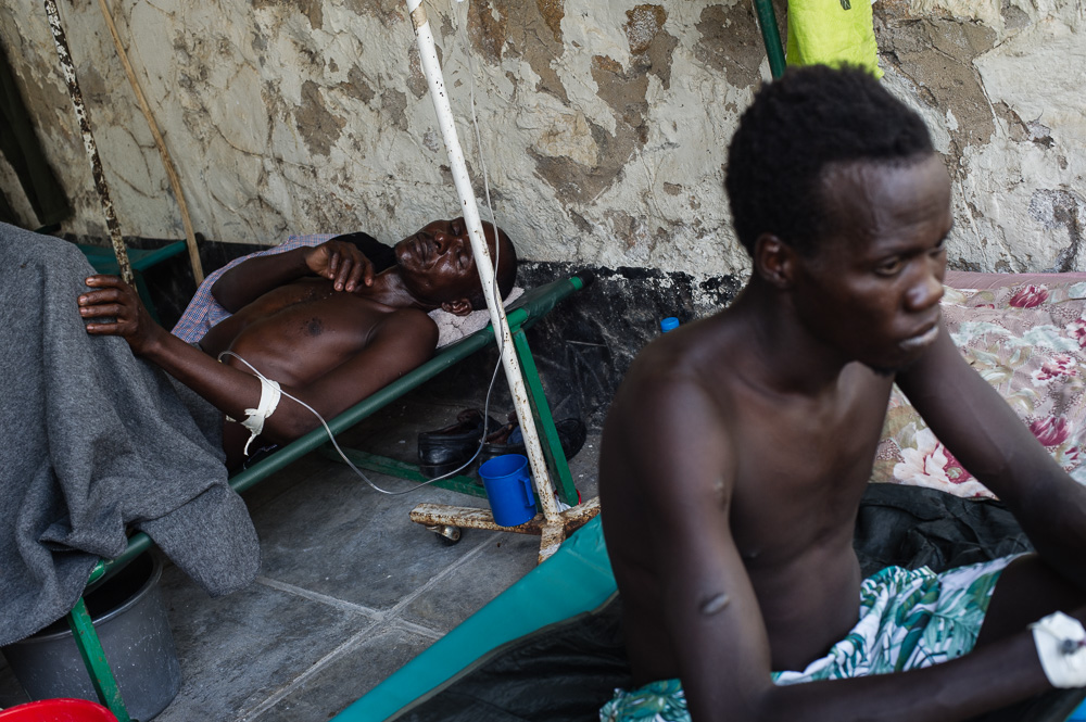 Cholera patients sit at the Juba Teaching Hospital