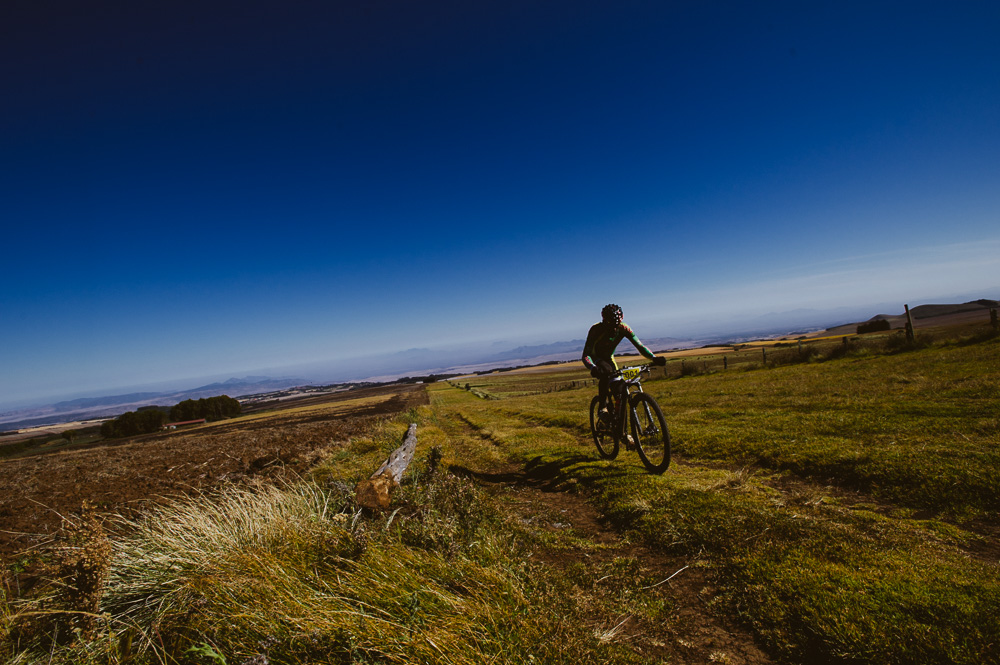 Race winner, David Kinjah, reaches the top most point, at around 10,000 feet, on the shoulder of Mount Kenya