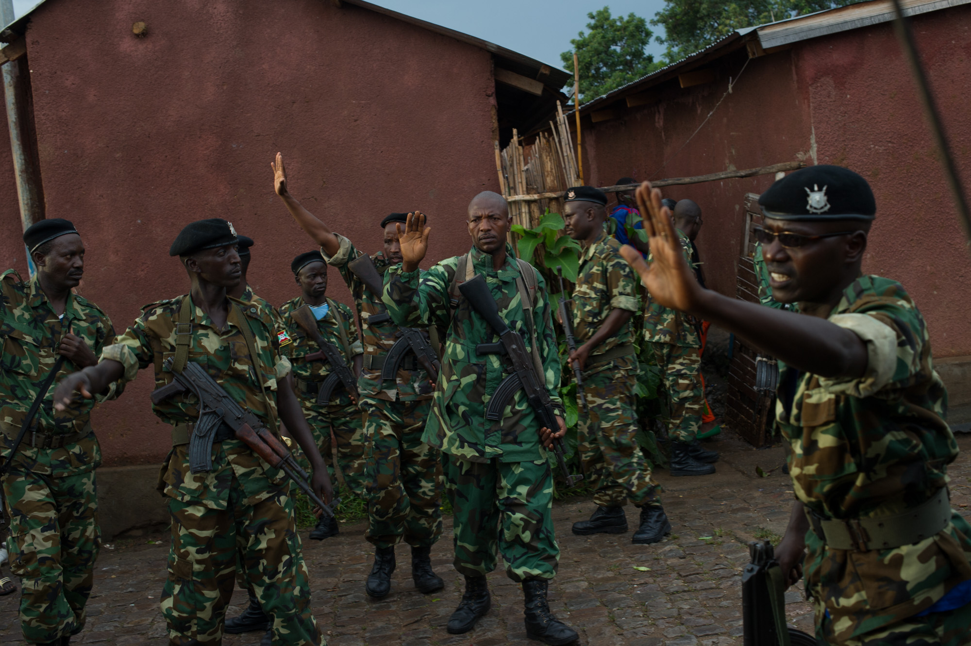 The army intervenes, trying to calm down protestors during clashes against police in the Nyakabiga neighbourhood of Bujumbura on May 8, 2015. Police, trying to clear barricades in the neighbourhood, clashed with protestors into this evening, dispersing them with tear-gas and a water cannon. 