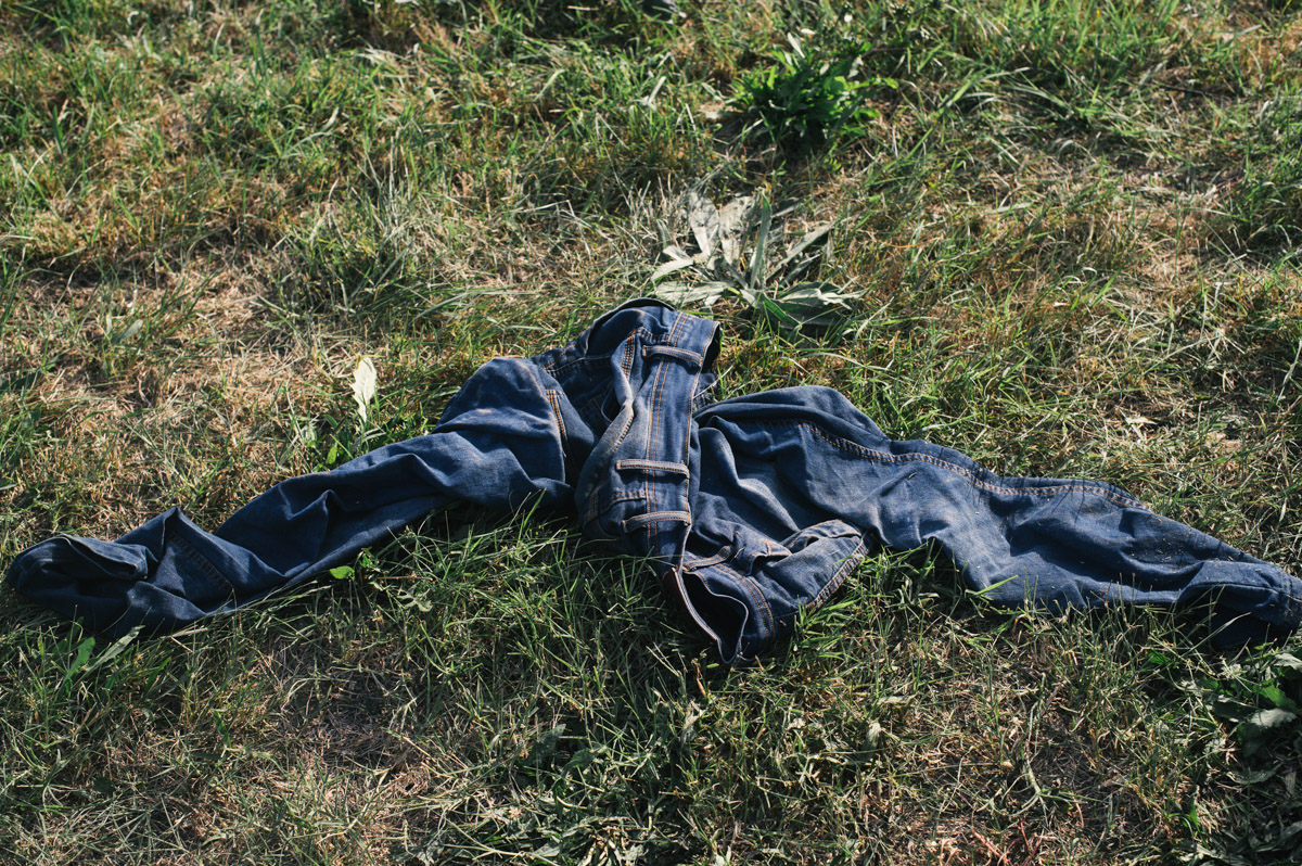 A pair of jeans lay by the roadside at the Croatian-Hungarian border at Beremend, in eastern Croatia, on September 18, 2015. Having crossed into Croatia from Serbia, and being kept in the town of Tovarnik, people were put on buses and brought up to the town of Beli Manastir and on to the border, where Hungary would bus them through to Austria.