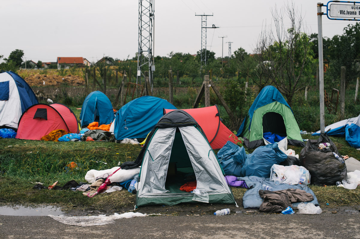 A tent, clothes and sleeping bag lay discarded by the side of the road in the town of Tovarnik, Croatia, on September 20, 2015. Thousands of people have come through Tovarnik en-route to northern Europe, and often stayed multiple nights. Some had shelter, sleeping in tents they had brought with them, but many slept outside. Some tents were left behind as people rushed to get on buses to travel onwards.