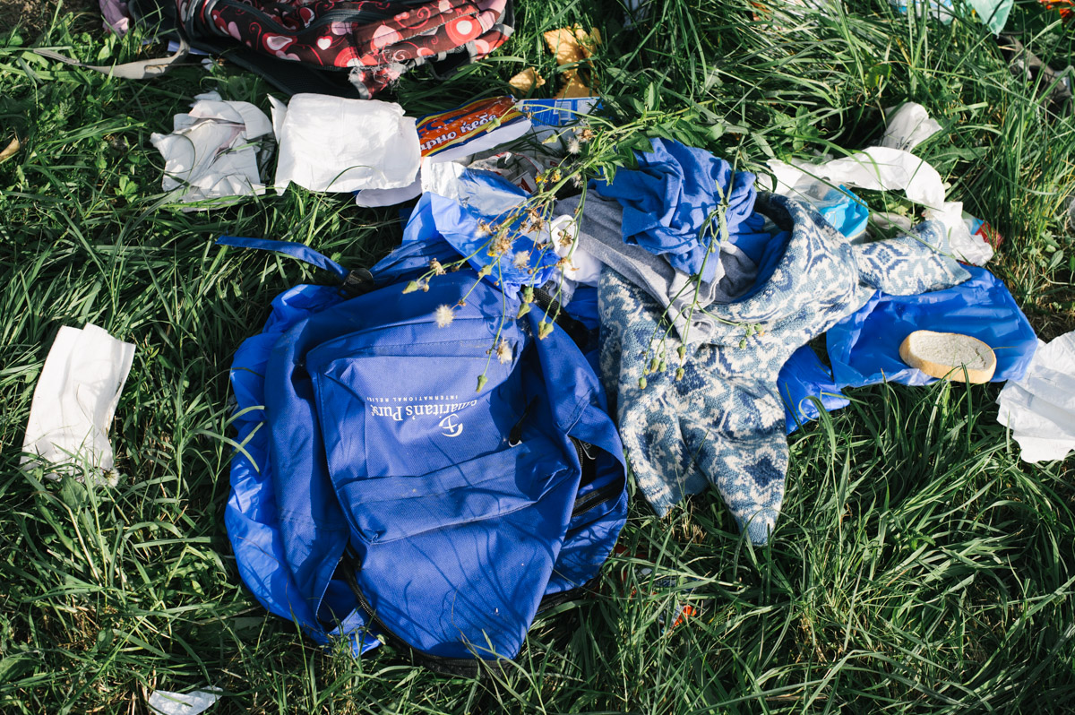 Clothes from a discarded bag lay by the roadside leading to the station in the town of Tovarnik, in eastern Croatia, on September 19, 2015. Having crossed into Croatia from Serbia, and being kept in the town of Tovarnik, people were put on buses and brought up to the town of Beli Manastir and on to the border, where Hungary would bus them through to Austria.
