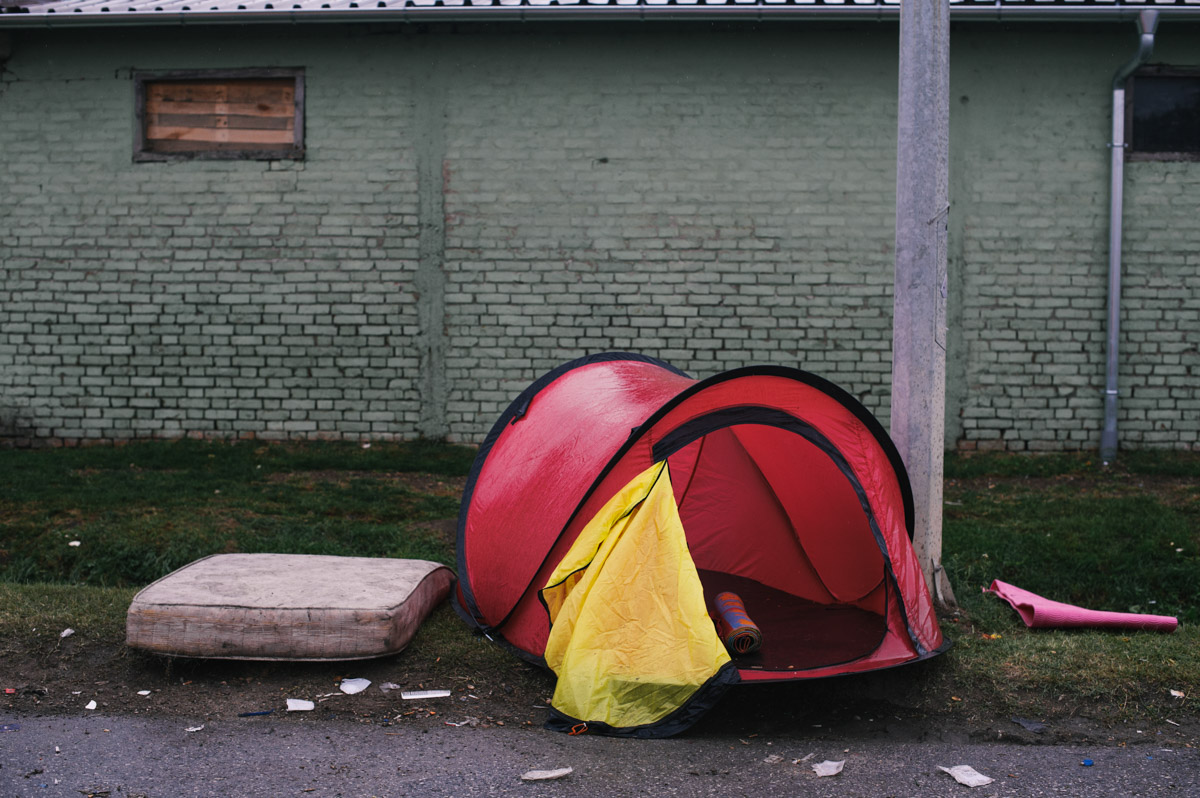 A discarded tent lays by the side of the road in the town of Tovarnik, Croatia, on September 20, 2015. Thousands of people have come through Tovarnik en-route to northern Europe, and often stayed multiple nights. Some had shelter, sleeping in tents they had brought with them, but many slept outside. Some tents were left behind as people rushed to get on buses to travel onwards.