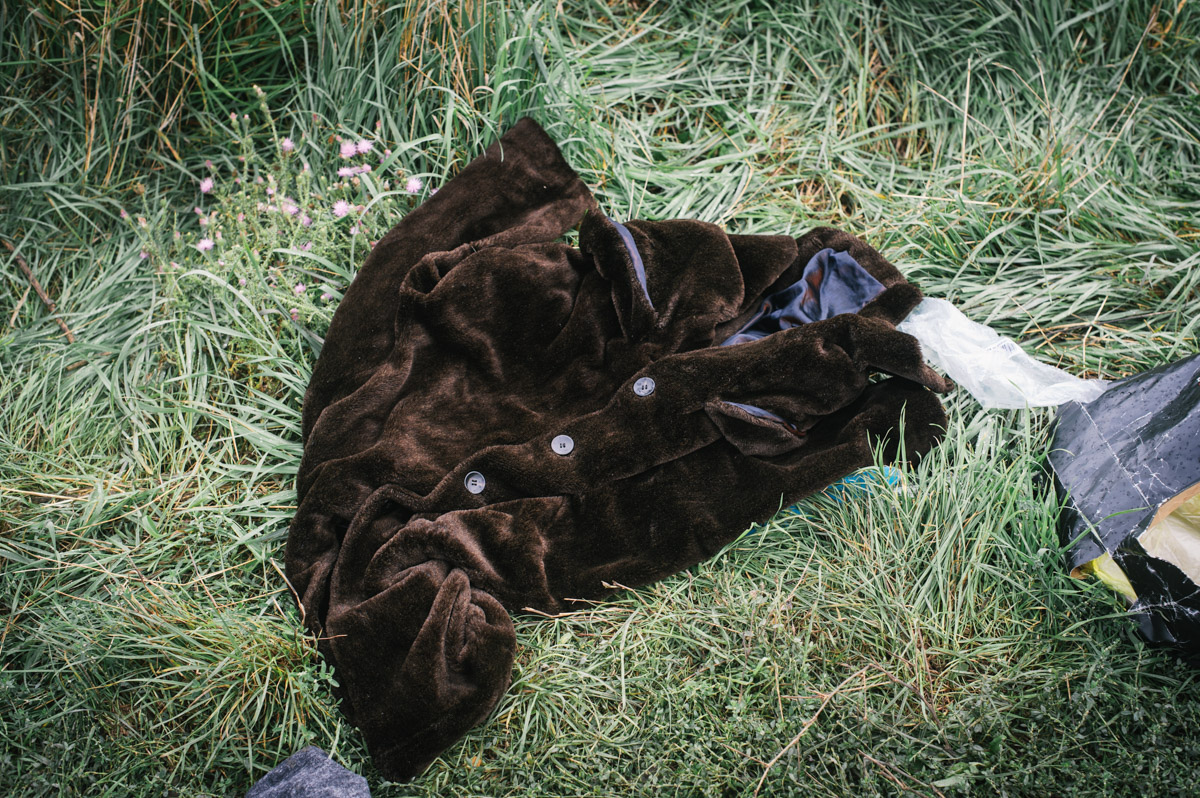 A faux fur coat lays discarded by the roadside leading to the station in the town of Tovarnik, in eastern Croatia, on September 20, 2015. Having crossed into Croatia from Serbia, and being kept in the town of Tovarnik, people were put on buses and brought up to the town of Beli Manastir and on to the border, where Hungary would bus them through to Austria.
