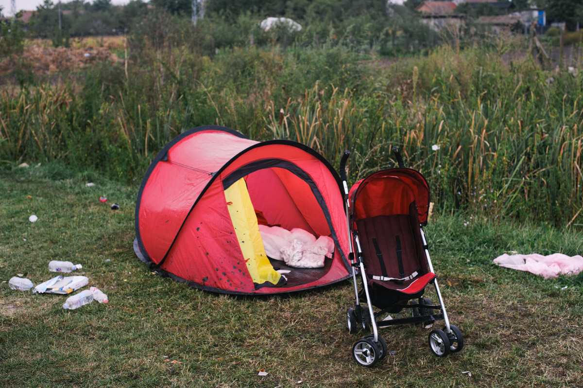 A discarded tent and baby stroller stand by the side of the road in the town of Tovarnik, Croatia, on September 20, 2015. Thousands of people have come through Tovarnik en-route to northern Europe, and often stayed multiple nights. Some had shelter, sleeping in tents they had brought with them, but many slept outside. Some tents were left behind as people rushed to get on buses to travel onwards.