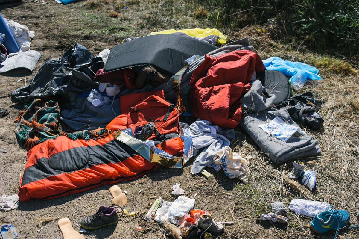 Clothes and sleeping materials lay discarded outside a transit centre set-up by Croatian authorities outside the town of Opatovac, Croatia, on September 23, 2015. After thousands of migrants and refugees started passing through Croatia from Serbia, following the Hungarians closing the border between Serbia and Hungary, Croatia struggled to deal with the people crossing its borders. The temporary camp was built for 4000 people, but was quickly overwhelmed.