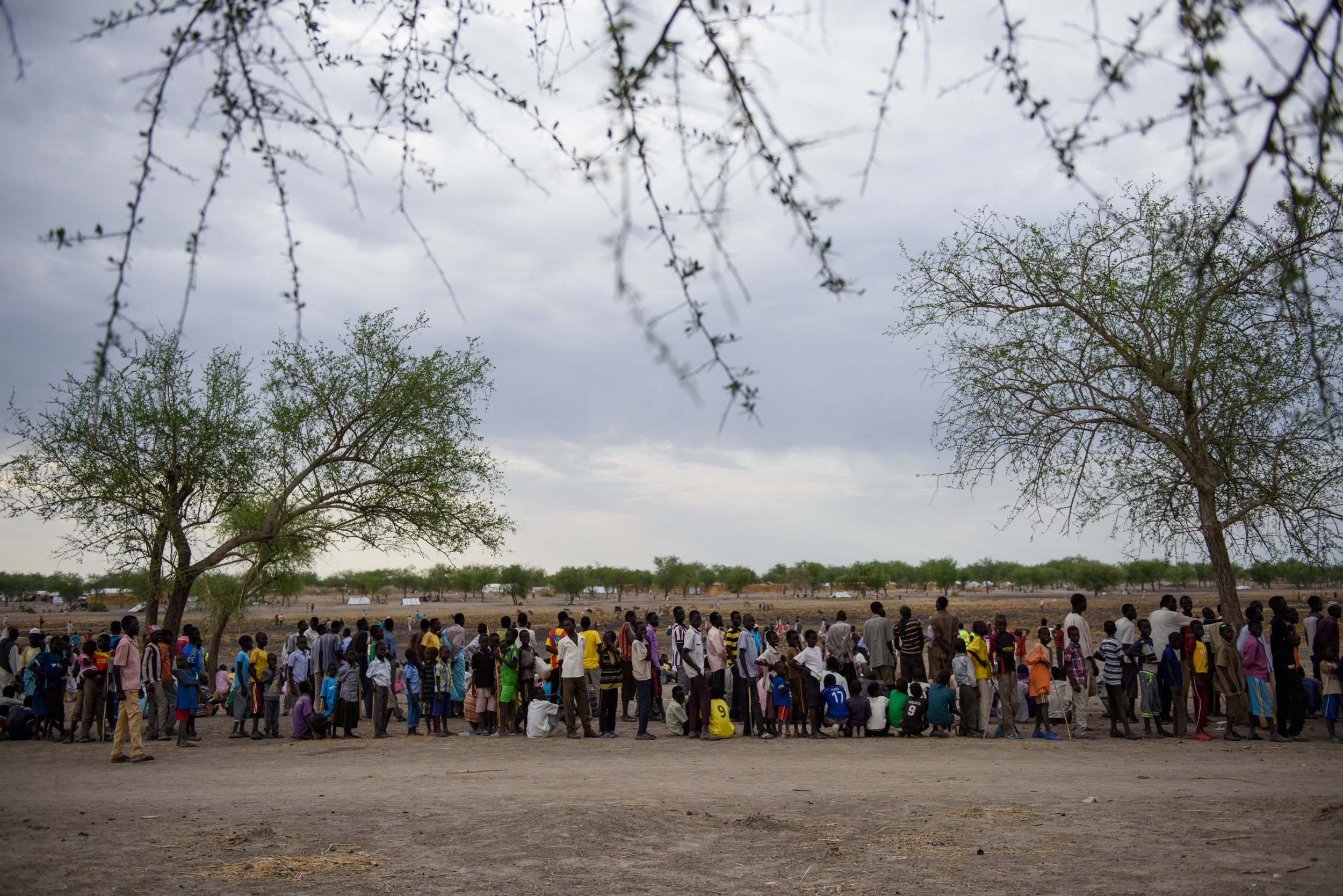 Internally displaced South Sudanese queue for registration by the World Food Programme and UNICEF during a week-long humanitarian mission to Aburoc, South Sudan, on May 12, 2017. Over 17,000 people were registered, to receive food aid, health screen