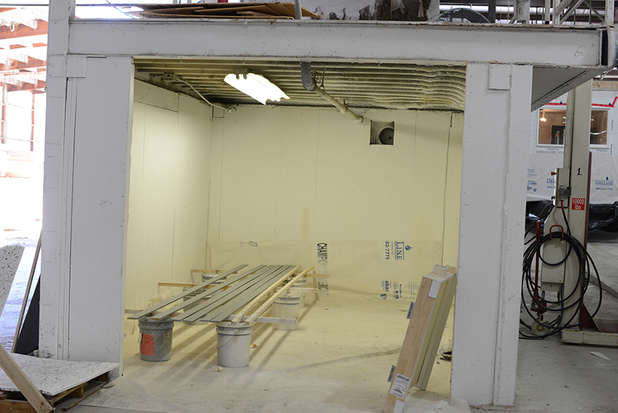 In a separate paint booth finish trim for base, door and windows is painted