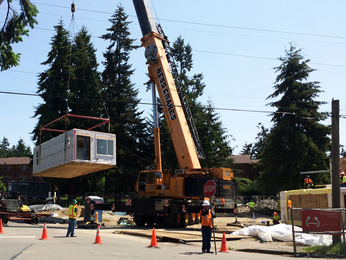 A 250-ton crane was used to lift the boxes onto the foundation. Special rigging is used and the crane location, and size, was dictated by existing power lines on site. 