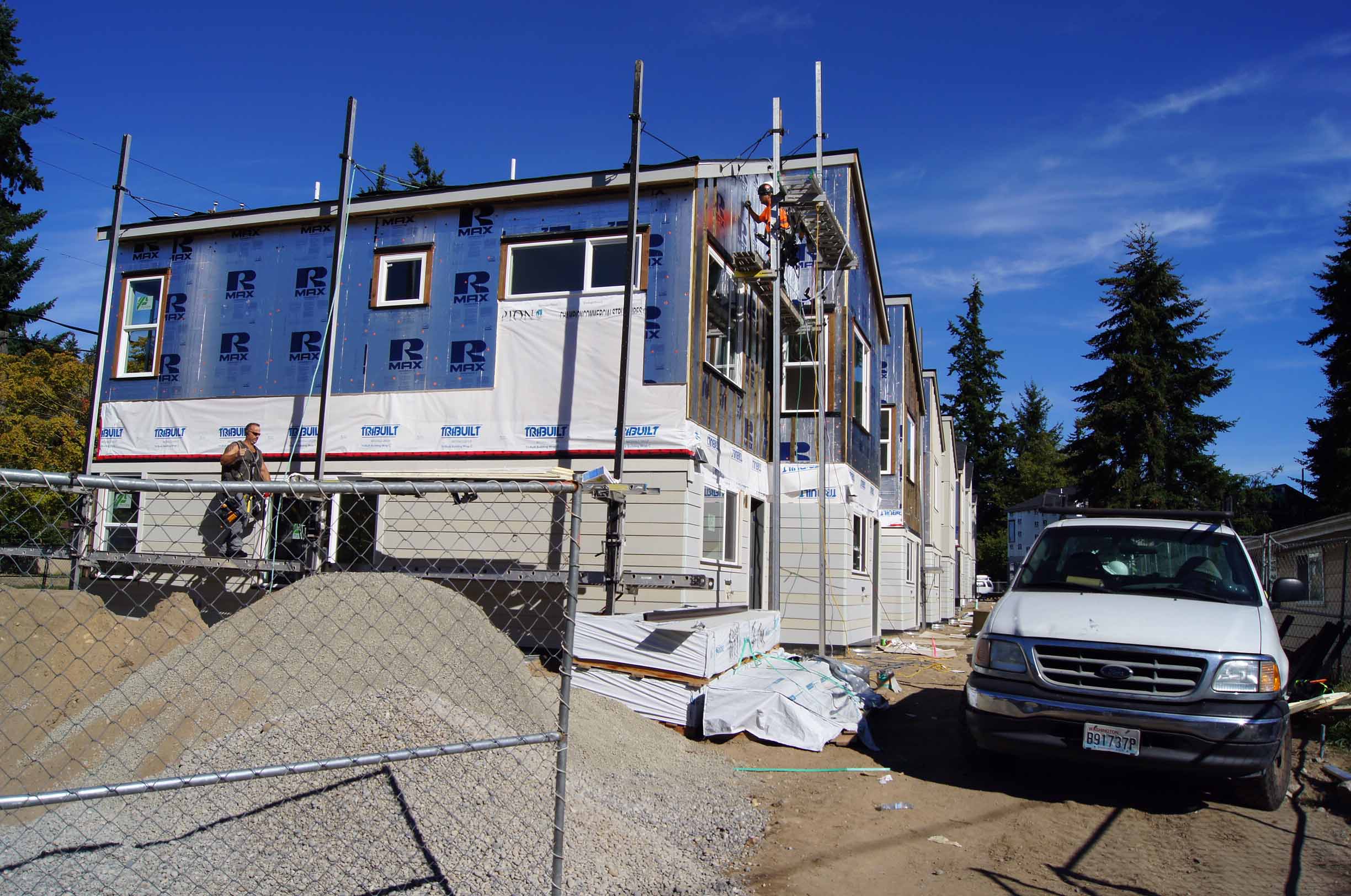 Continuous exterior insulation is installed and the siding goes on shortly thereafter. 