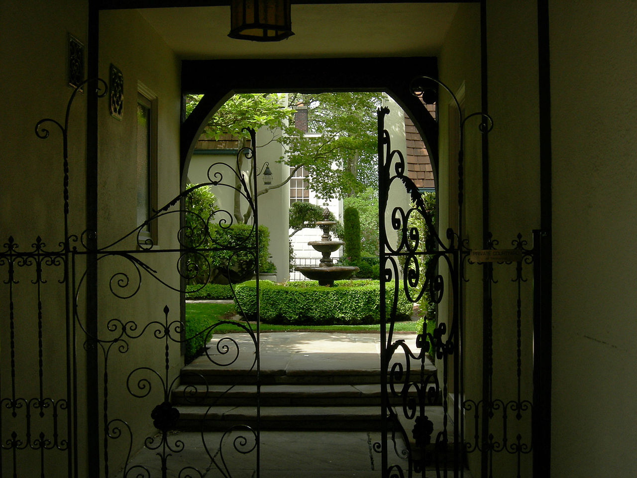 "The Loveless Building scale is outstanding along the sidewalk, as is the material textures, and expression of uses. The glimpse of the courtyard seen passing by the gate is very compelling, followed by the traditional sequence of compression of view in the tunnel, and expansion into the garden, and the tree canopy overhead."