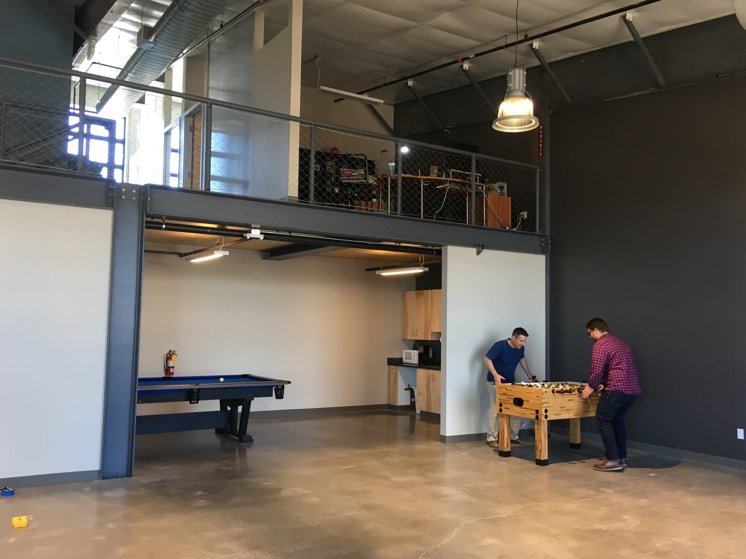 Architects at a foosball table.