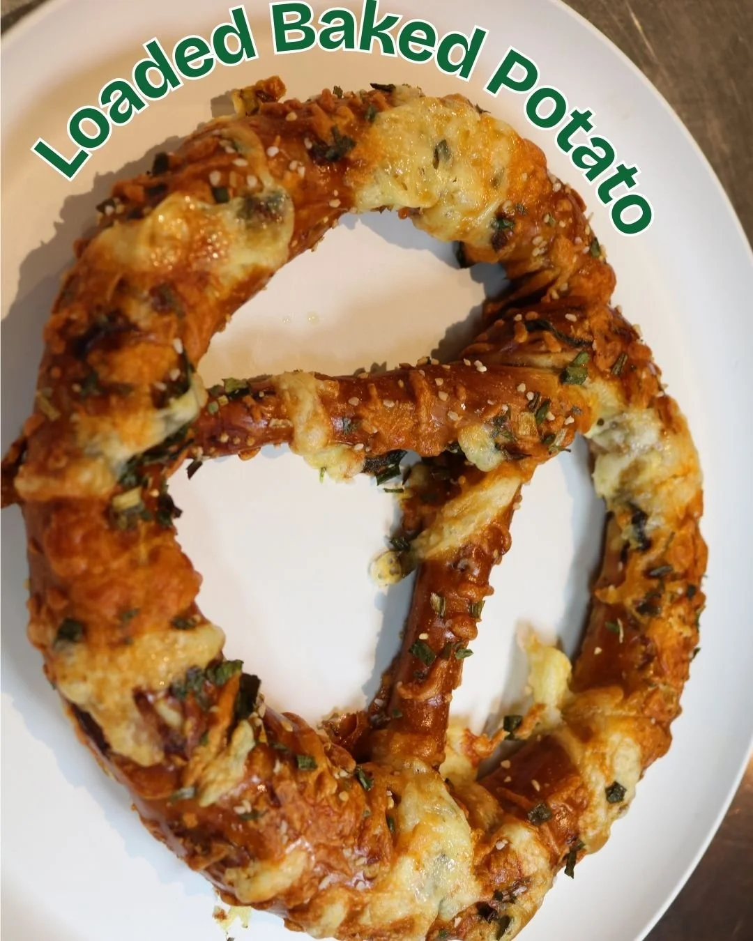 🥔🧀 Say hello to your new fall favorite: our Loaded Baked Potato Pretzel! We start by roasting potatoes and onions, mix them right into the dough, then top it all off with dried chives, sharp cheddar, and smoked gouda&mdash;giving you all that heart