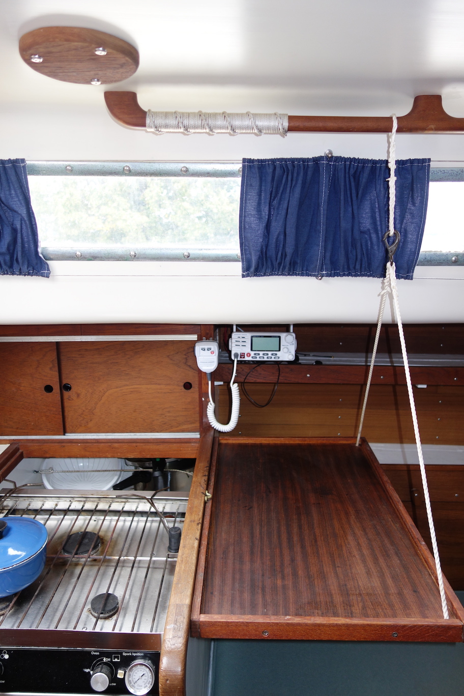  Custom table adds extra galley counter space and folds away. Can even sleep on the settee with the table up! Your feet go underneath... 