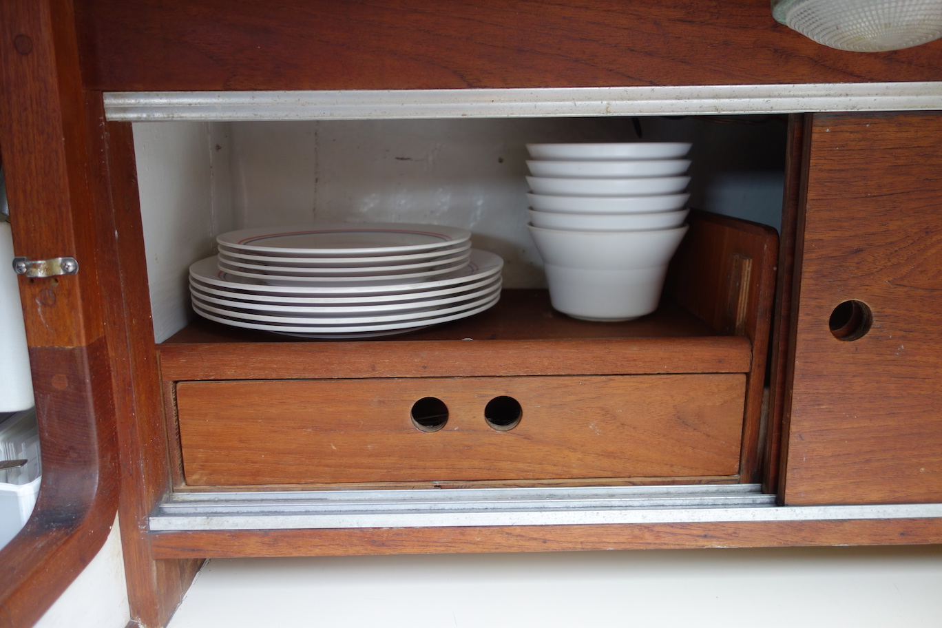  Clever galley storage for plates and cutlery. 