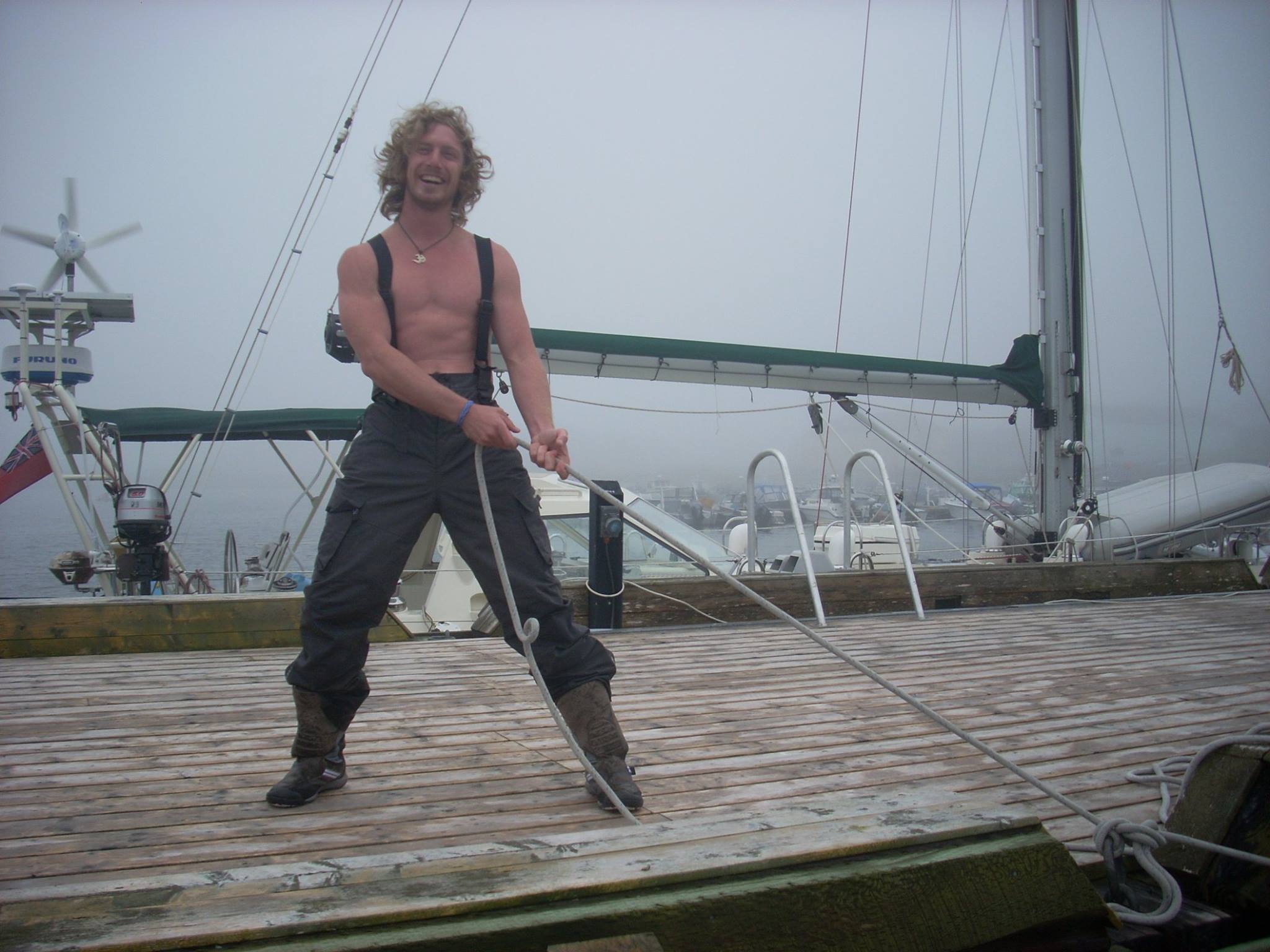 Clint helping tie the docklines on Arcturus in St. Pierre in 2011, en route across the Atlantic.