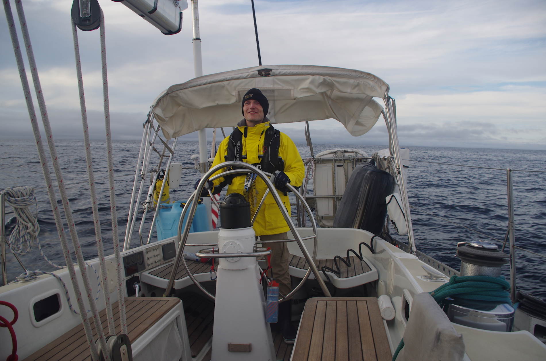 Doug at the helm on a rare moment of clear skies shortly after leaving St. John's. It wouldn't last!