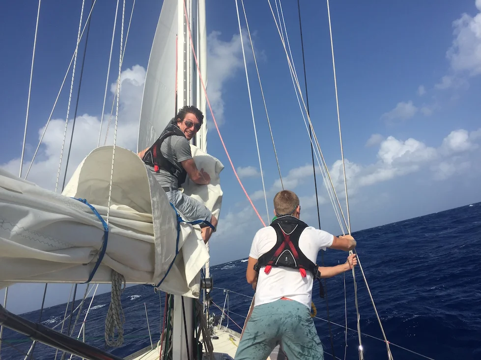 Clint Wells & Andy rigging the trysail after blowing out the mainsail.