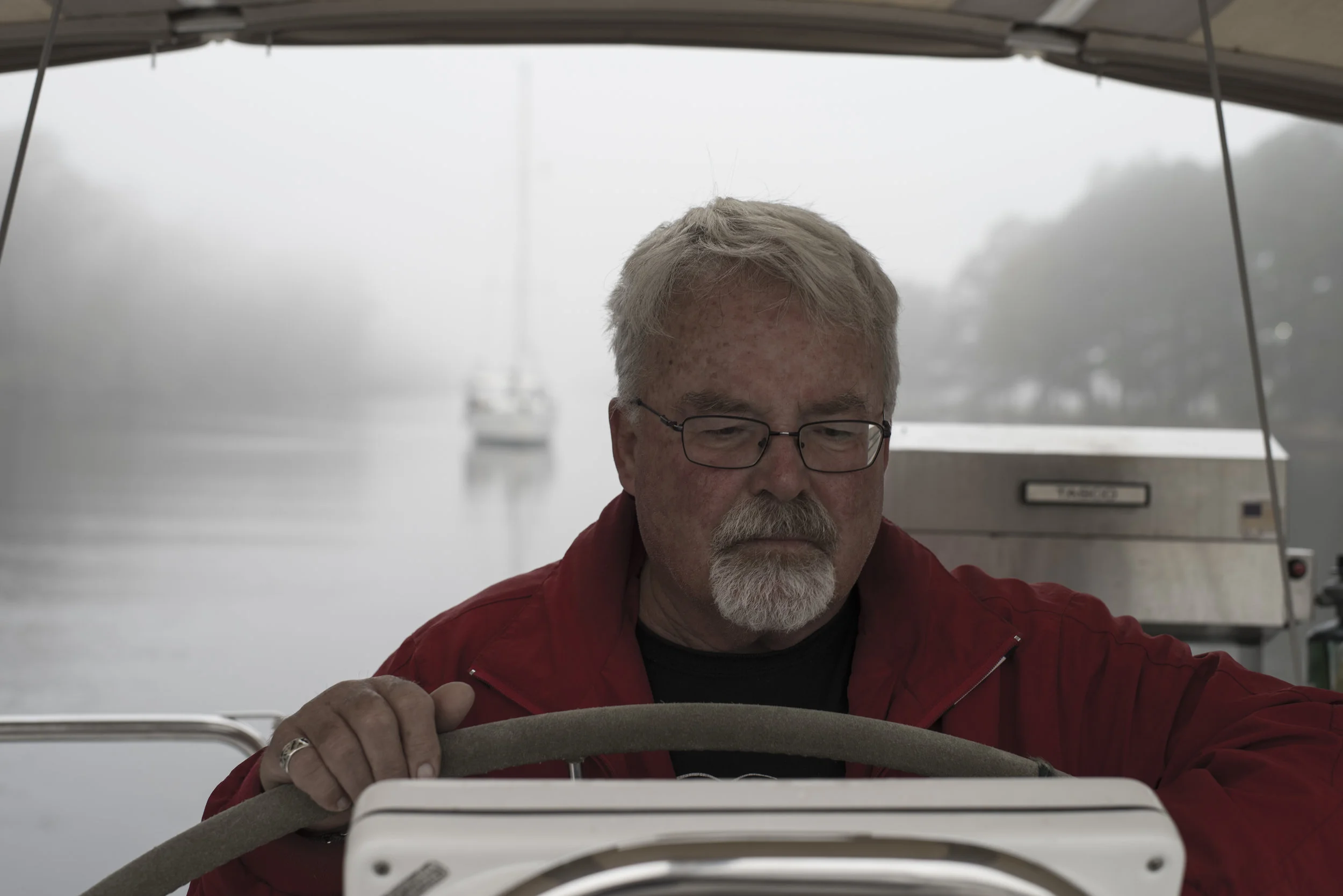 Capt. Dennis (aka 'Andy's Dad') at the helm in the morning mist a few days back.