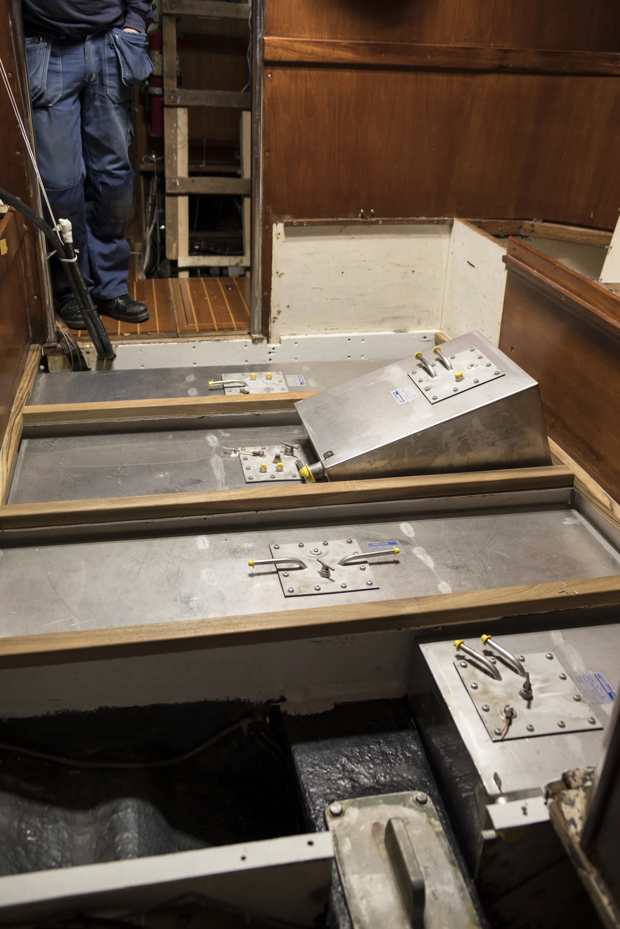 Painted bilges, new tanks ready to go in, and new teak under the floorboards.