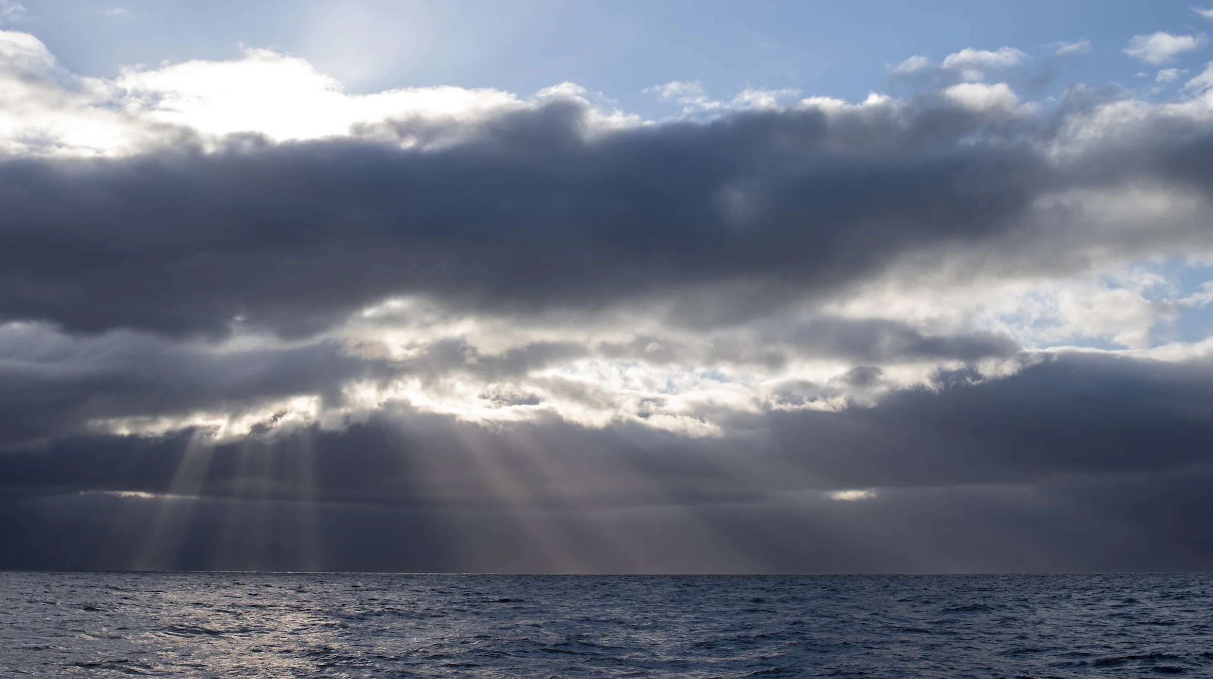 Late afternoon sunbeams in the Vestfjord after leaving Reine.
