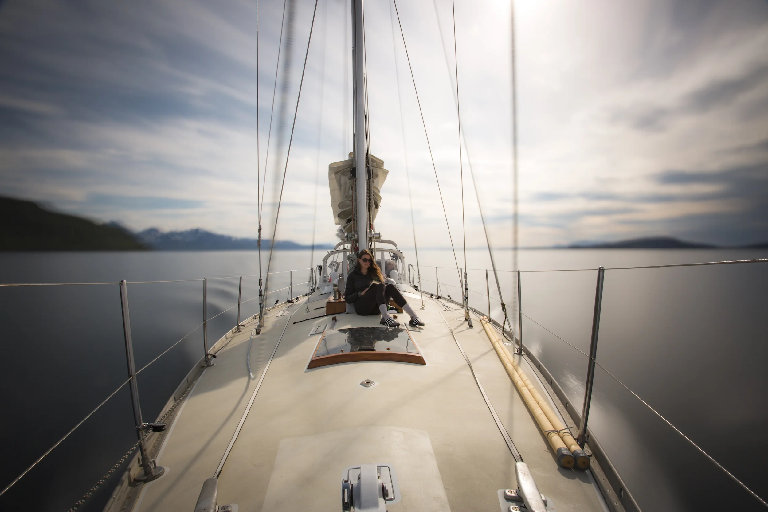 Isbjorn crew Laura Gale chilling on the foredeck while ship's photographer James Austrums plays with long exposures while we motored.