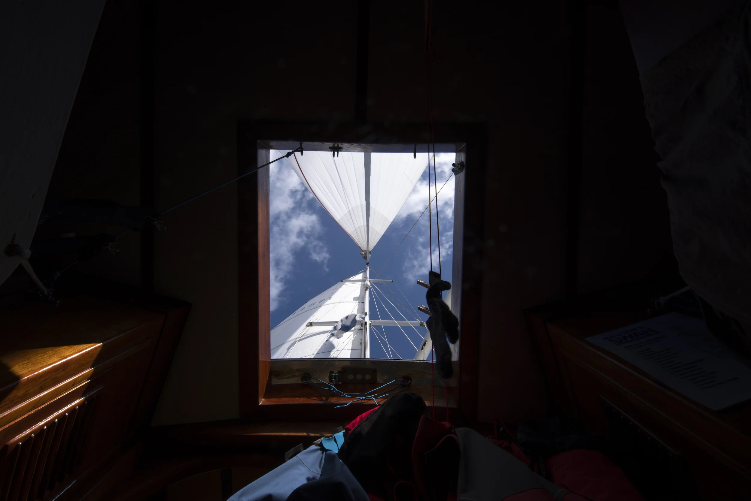 View from the forepeak cabin under spinnaker. Not a bad place to nap on a nice downwind day!