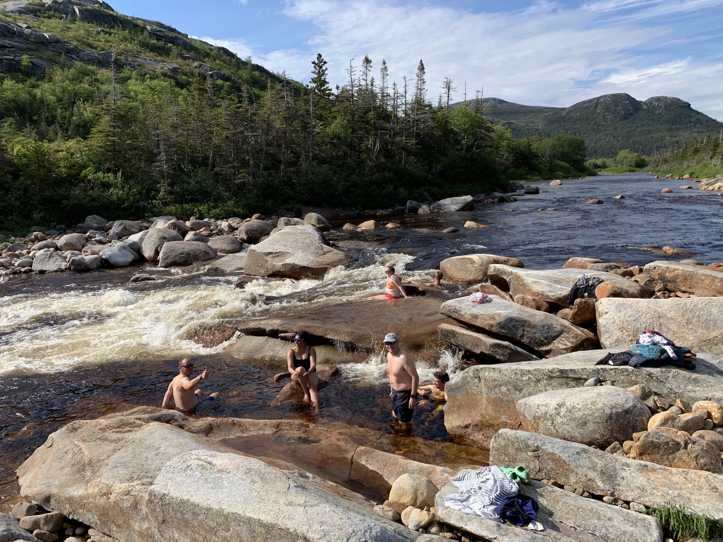 Freshwater swim in the Morgan River, above Morgan Falls in the NE Arm of Hare Bay fjord.