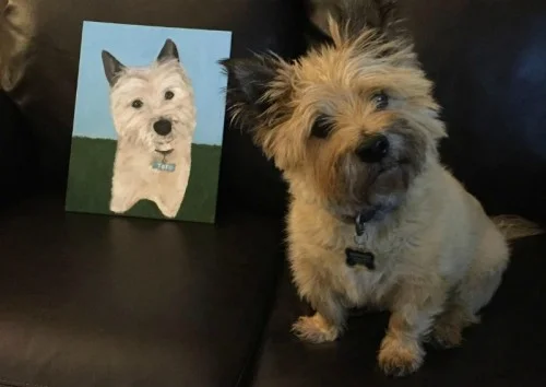 The author’s artwork, next to a satisfied customer.