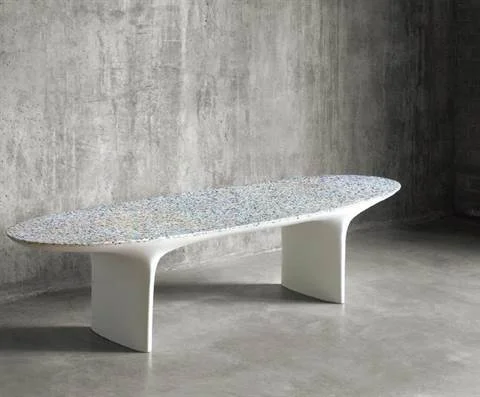 Fragments of plastic that washed up on beaches are being used to create eye-catching furniture, such as the Flotsam table.
