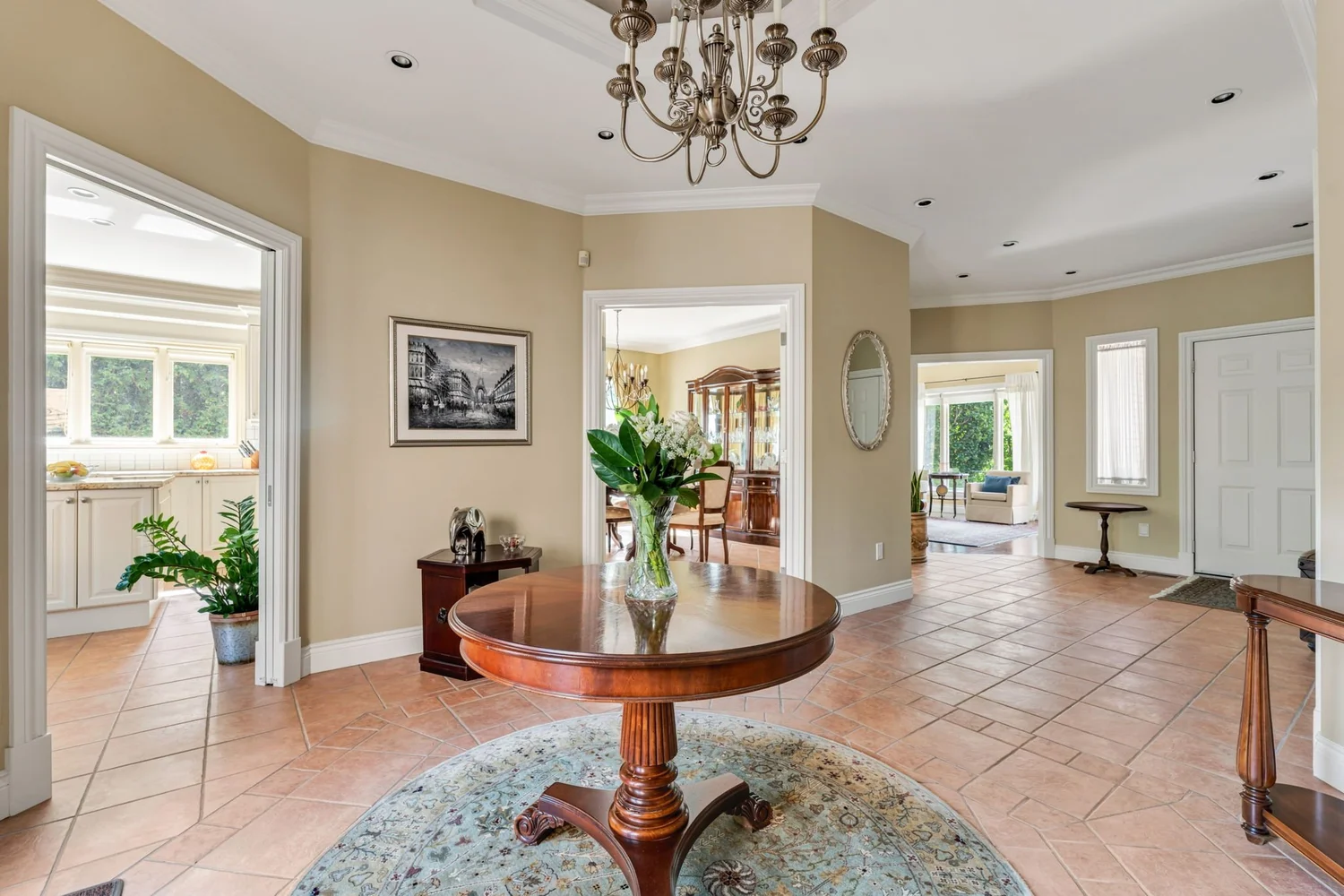 Grand sitting room with domed ceiling, chandelier and sightlines through the main floor