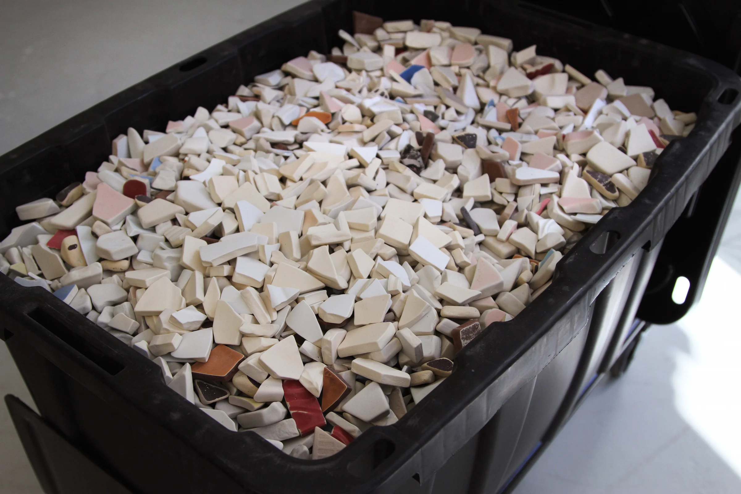 Potsherds is a process-driven project begun in 2014 involving the collecting, accessioning, and tumbling of broken ceramic shards found in the artists daily life. Currently comprising of 300 lbs of processed ceramic material, the work acts as a sort of reverse archaeology, producing masses of human fragments of a significance eroded by both abrasion and abundance.