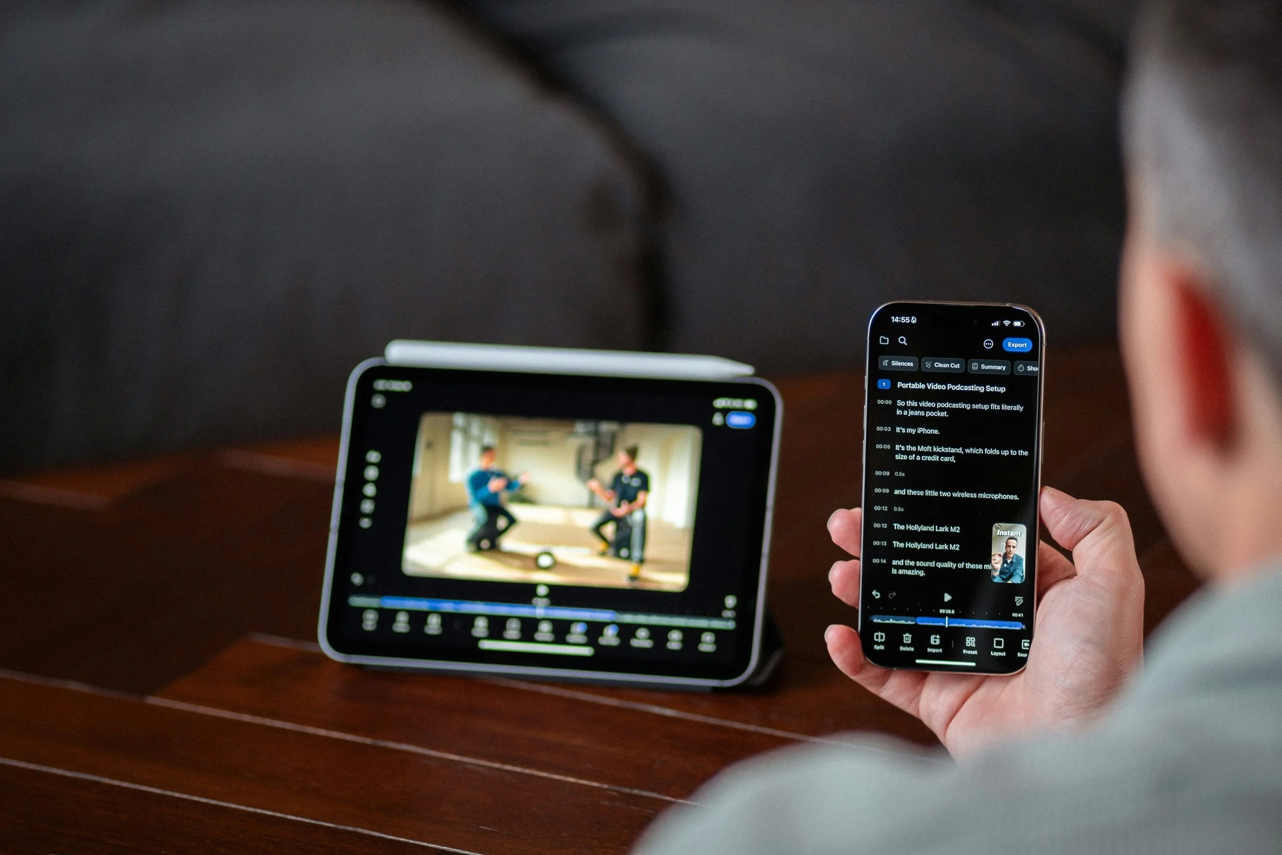 A viewer watches a video on their tablet and transcript on their phone.