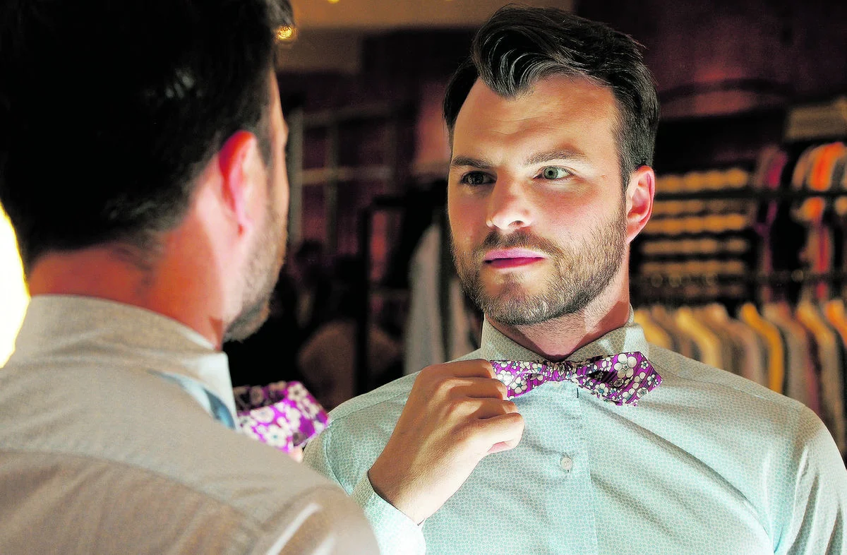 Chad Helm, owner of The Helm, a menswear clothing store in downtown Edmonton, wears a floral shirt and bow tie. He says men's floral is seeing an evolution and is expected to flourish this fall. Photo Credit: Larry Wong/Edmonton Journal
