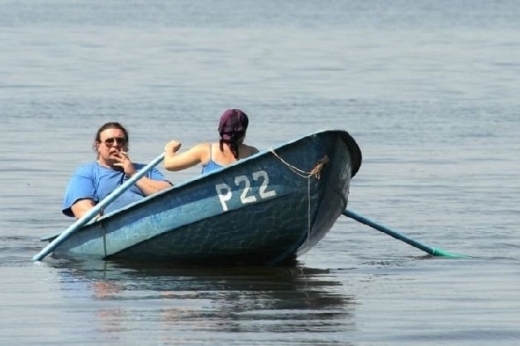 Bad-husbands-fat-man-in-boat-smoking-while-girl-ro1